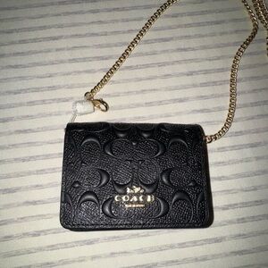 Coach Black mini wallet on a chain